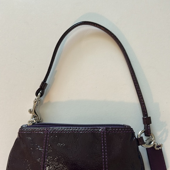 EUC Coach patent leather wristlet in dark purple or plum color and silver metal - Picture 8 of 10